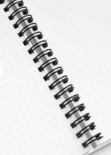 Notepad takes center stage with its pages open, revealing the intricate details. The black spiral wire, elegantly binding the notepad, stands out against the backdrop, adding a touch of sophistication. The dotted pages, meticulously designed for creative expression, come to life, inviting you to explore the limitless possibilities they offer. This snapshot captures the essence of MeaKulpa's commitment to quality, creativity, and the rebellious spirit that defines each page of this exceptional notepad.