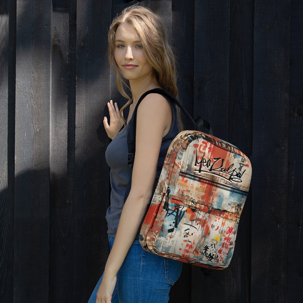 Dive into street-style chic with the MeaKulpa Medium Size Backpack in this captivating image. As the backpack graces the shoulders of our model, it becomes more than an accessory; it's a statement piece. The graffiti design adds an urban edge, complementing the wearer's dynamic lifestyle. The spacious compartments not only accommodate daily essentials but also provide room for a sketch pad and spray cans, reflecting the creativity that accompanies every journey.