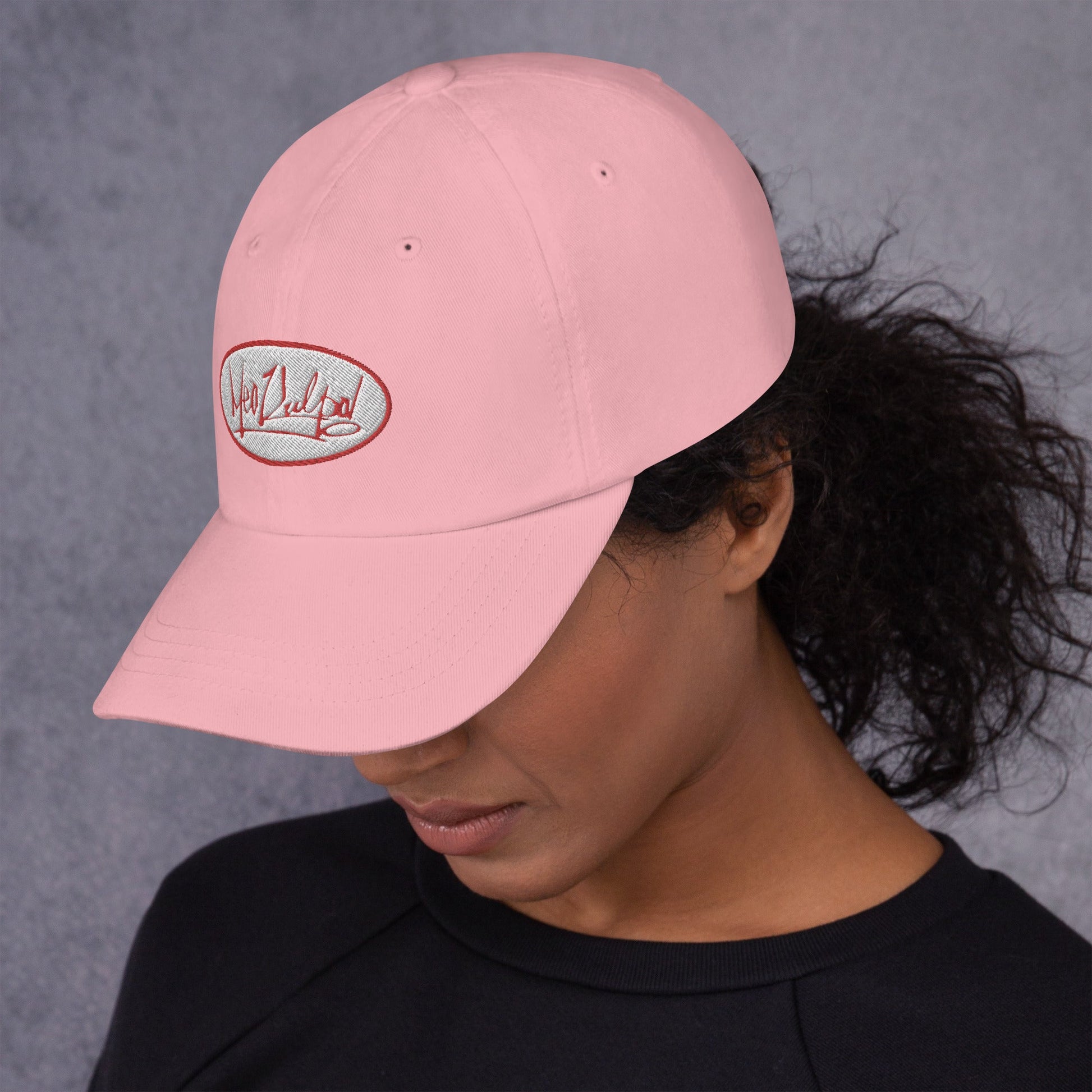 Meet our trendsetter in the MeaKulpa Pink Hat featuring the iconic Red and White OG Logo. With an air of confidence, she effortlessly fuses street-style chic with a touch of rebellion, creating a look that's both edgy and charming. Embrace the vibe and make your statement.