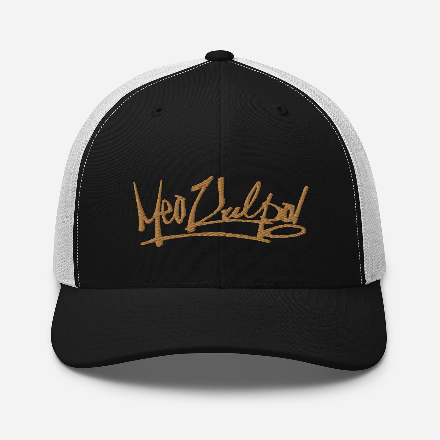 Close-up Detail of Gold MeaKulpa Logo on Trucker Cap - Dive into the details with a close-up of the MeaKulpa Trucker Cap. The gold MeaKulpa logo is intricately embedded on the front, showcasing the meticulous craftsmanship. Elevate your headwear game with this signature piece