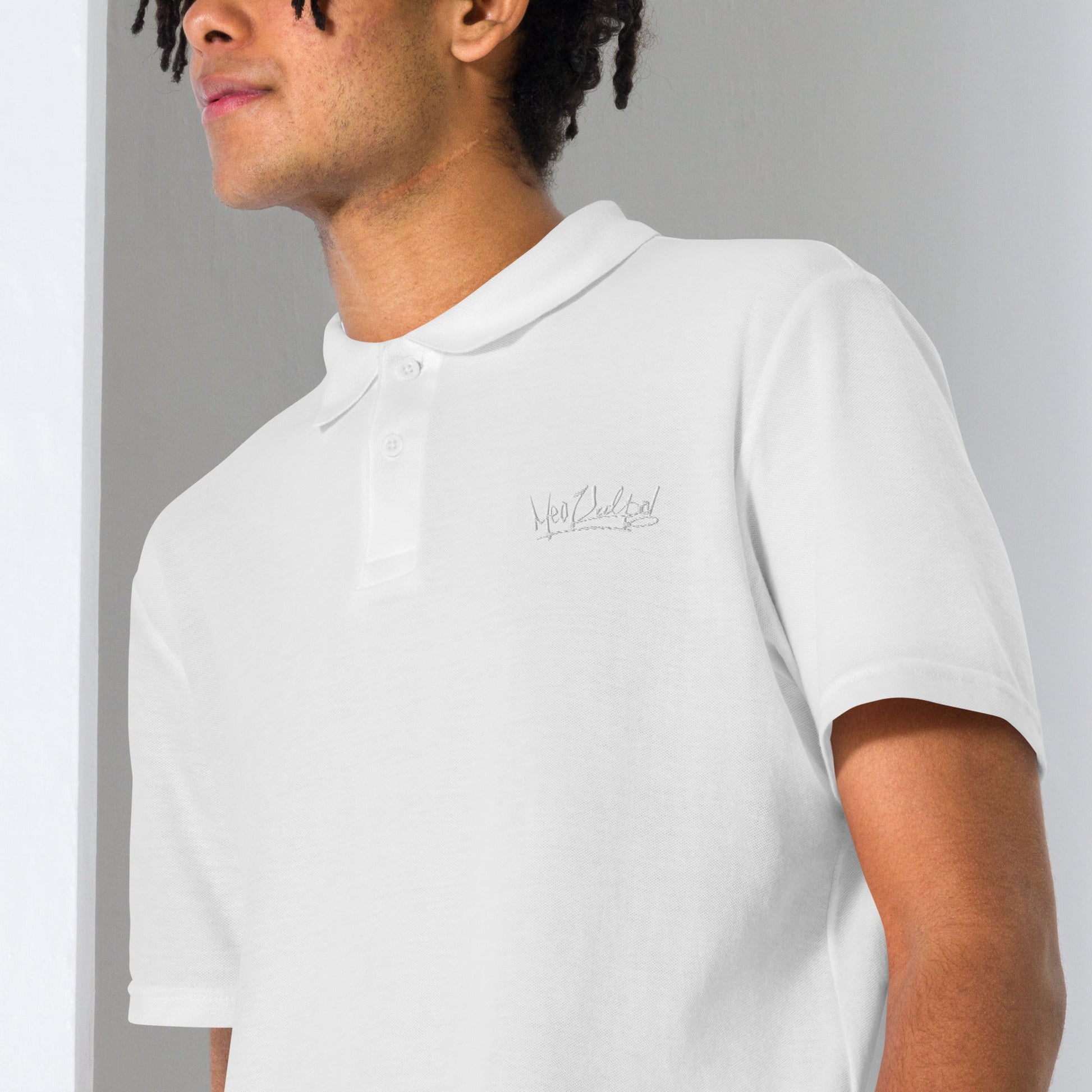 Embrace effortless elegance with the MeaKulpa Unisex Pique Polo Shirt in White. Made from high-quality ring-spun cotton, this shirt combines comfort with timeless style. Its semi-fitted silhouette and classic collar make it a versatile addition to any wardrobe. Dress it up with chinos for a smart-casual look or pair it with jeans for a relaxed weekend vibe. The perfect choice for understated sophistication. Boy side shot